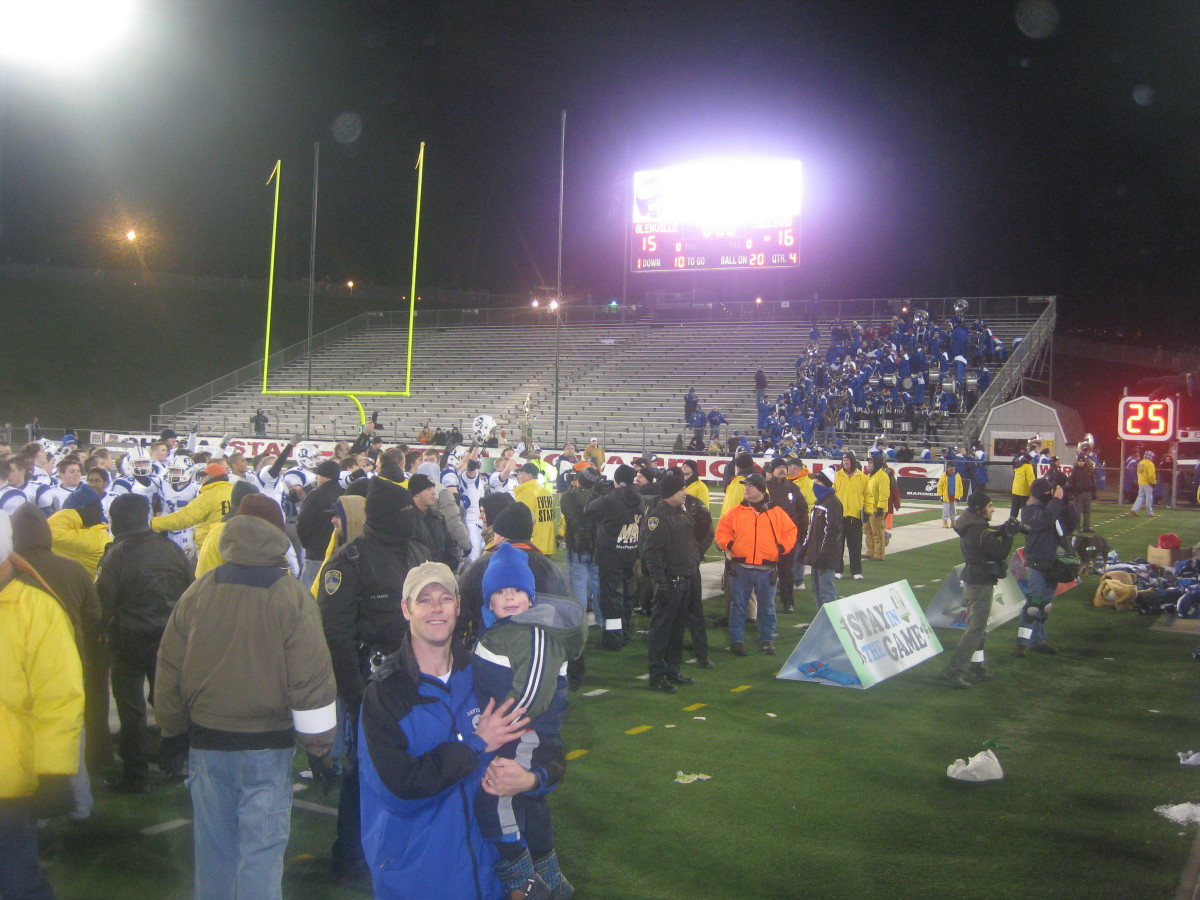 John DiBlasio holds son Johnny at the 2009 state championship game (photo courtesy of the DiBlasio family)